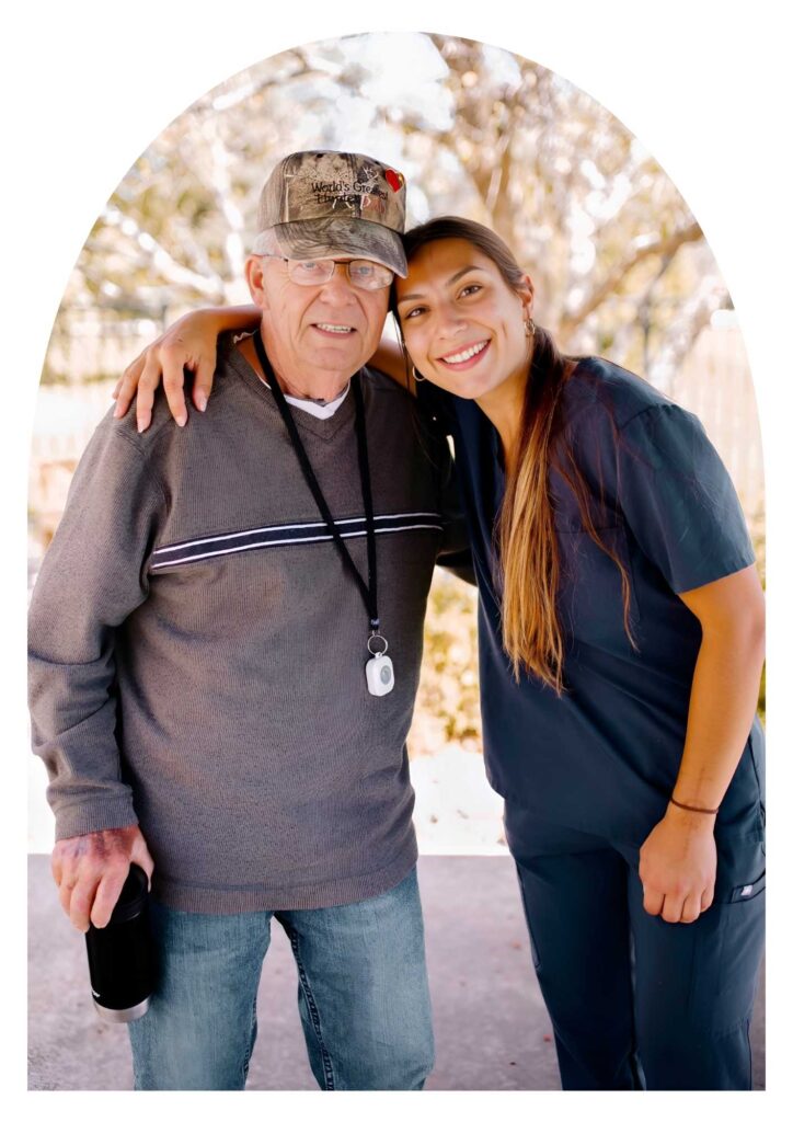 Resident smiles warmly with caregiver at Serenity Villa