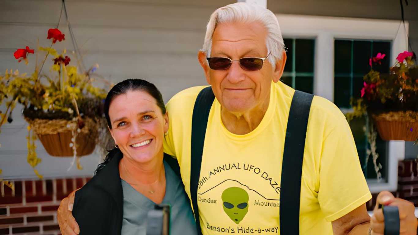 Resident shares a warm smile with a caregiver at Lily Meadows.