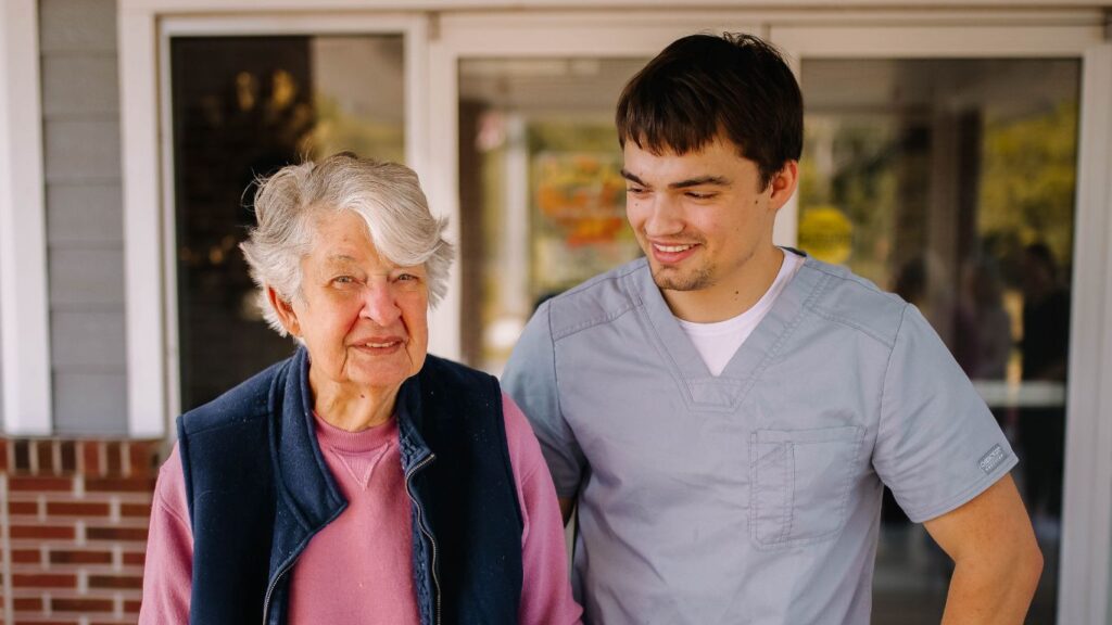 A caregiver interacting with a resident at Lily Meadows