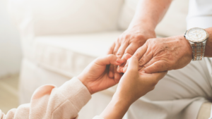 elderly parent having a touching conversation with daughter