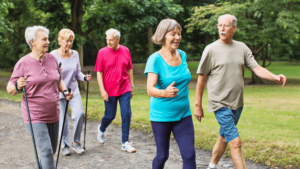 Seniors enjoying a healthy walk in the park for heart wellness