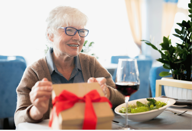 Senior citizen woman receives a gift