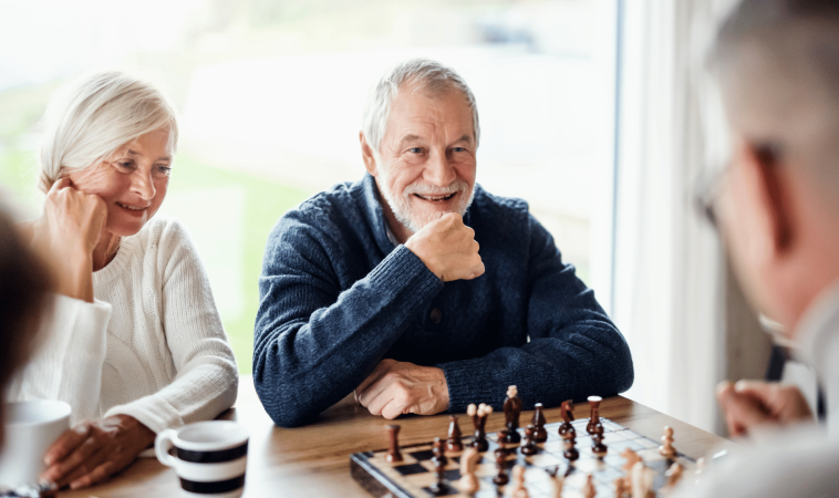 Seniors enjoying leisure and activity in a Traditions Senior Care facility