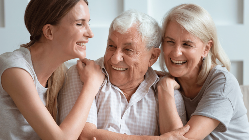 Daughter having a supportive conversation with senior parents